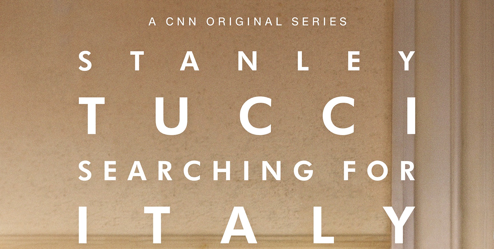 Tucci_keyart_Wall_Vertical_dated_72dpi-1